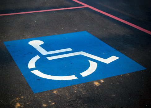 A blue sign on a road.